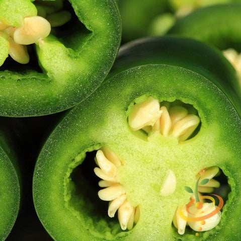 Close-up of sliced green jalapeño pepper showing seeds and inner texture