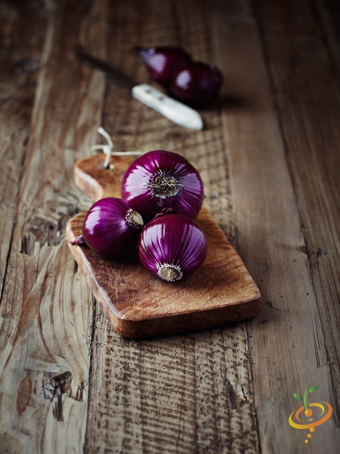 Red Globe Long Day onion seeds from SeedsNow, showing vibrant red onion bulbs and fresh green foliage.